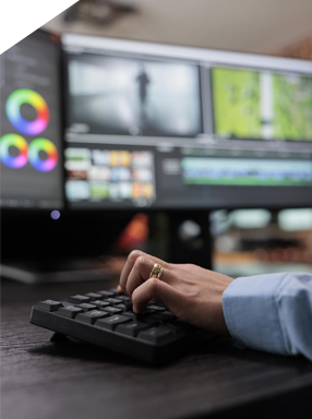 Graphic designers and printing experts at work in Dimension Multimedia office